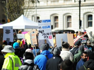 Protesters in Baltimore rally against secret police, advocating for human rights.